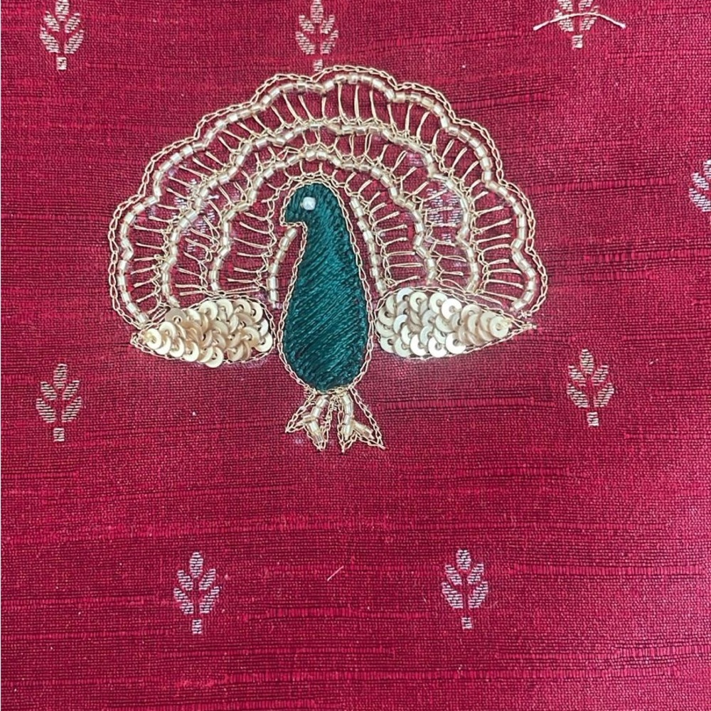 Embroidered Peacock Design on Red Fabric